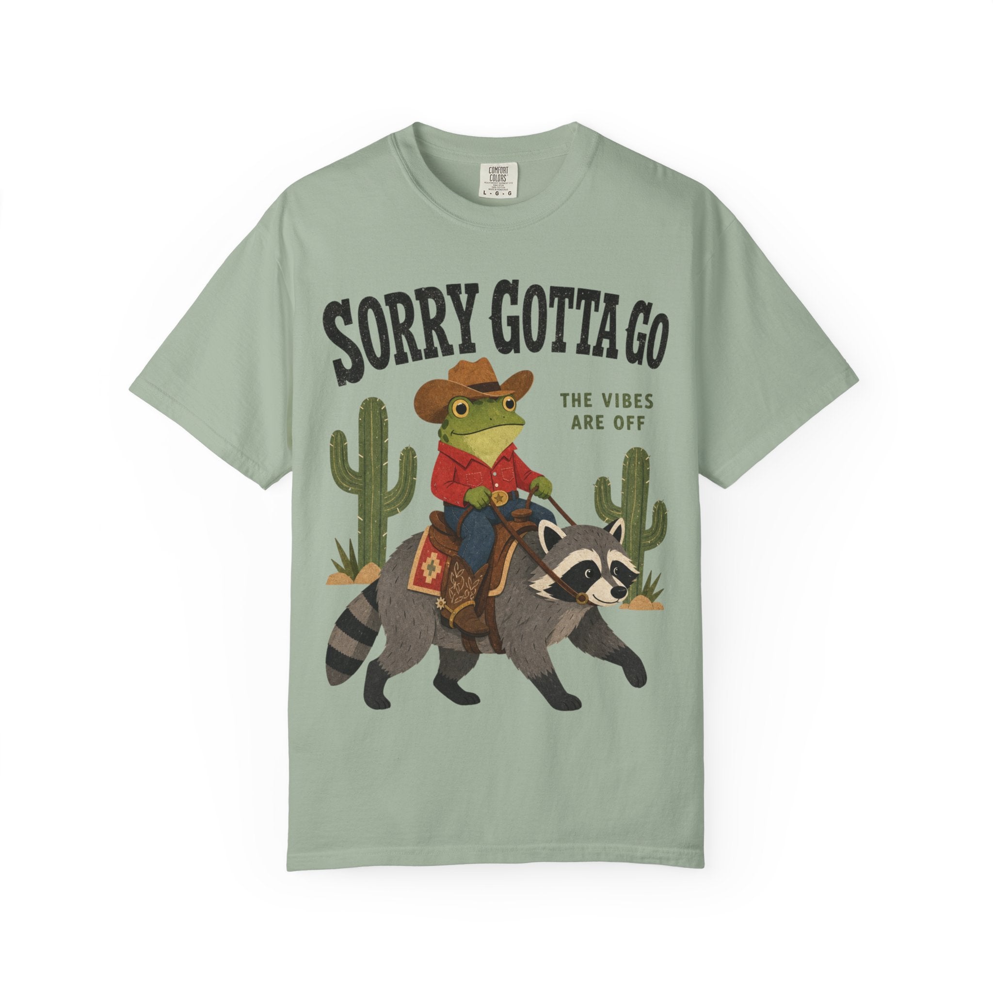 Sorry Gotta Go T-Shirt — Cowboy Frog Riding Raccoon (The Vibes Are Off)